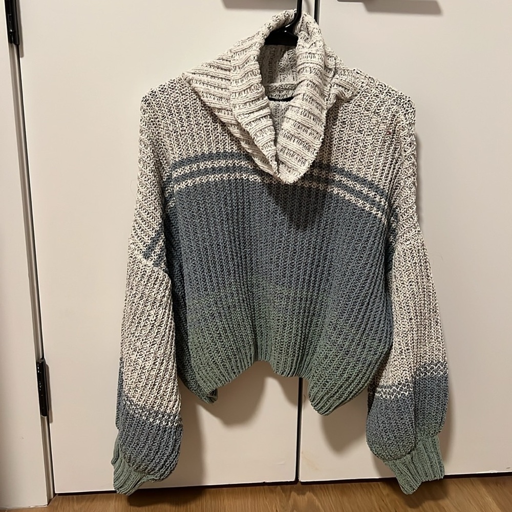Multi colored sweater with a cowl neck. Knit material. Size small. Oversized fit